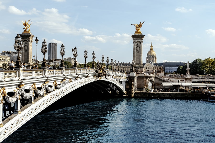 An ornate bridge spanning water, Paris